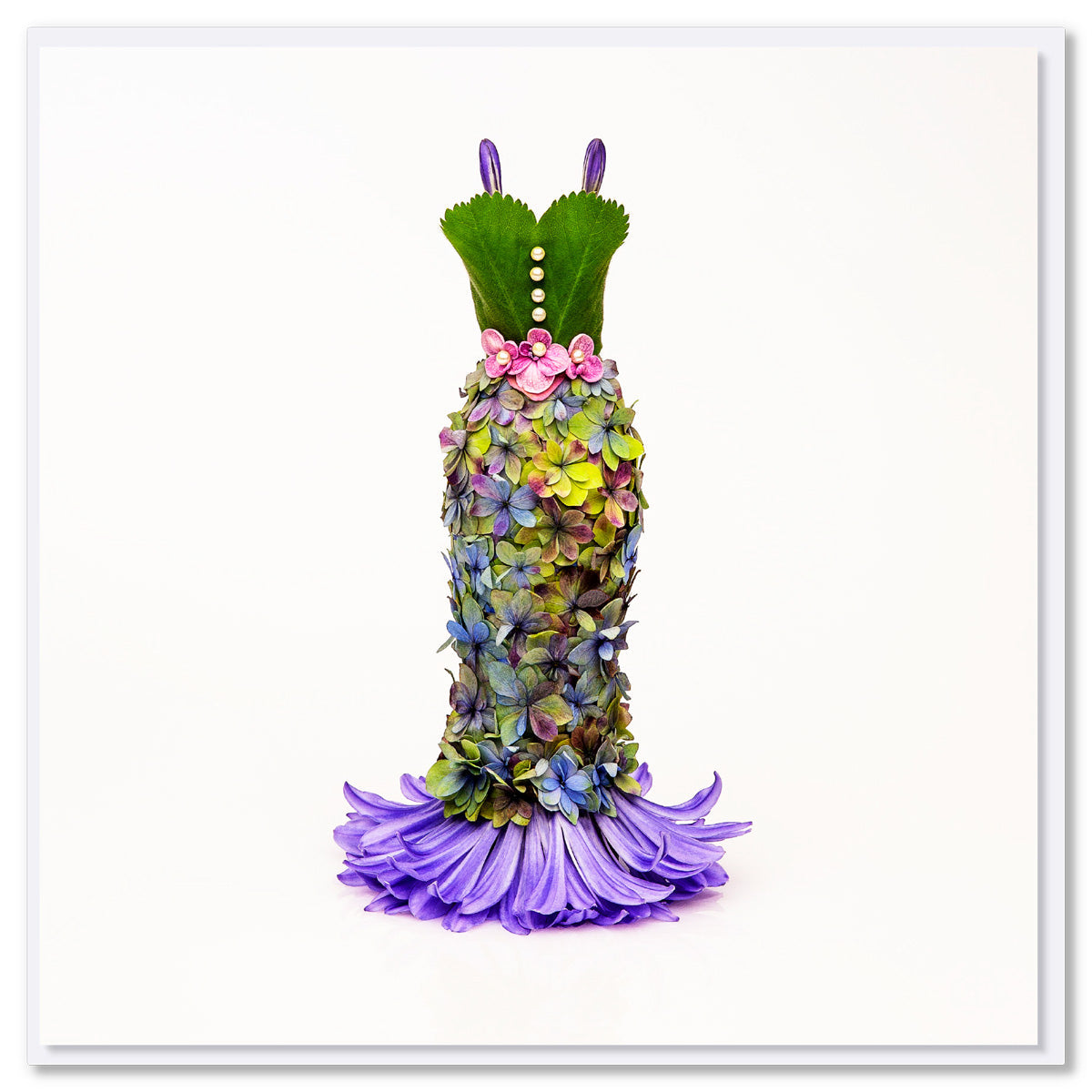 An elegant hydrangea dress greeting card from Golly Gosh Creations. Size 142 x 142 mm. Created from dainty hydrangea petals on a white background.