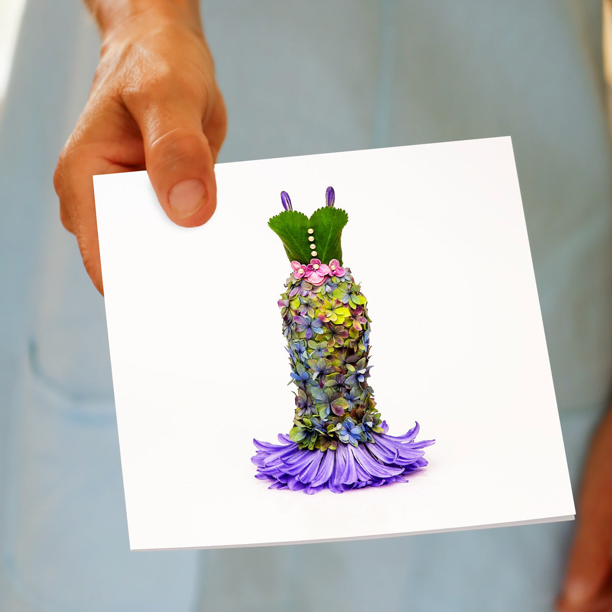 A hand held hydrangea dress greeting card from Golly Gosh Creations. An elegant creation from dainty hydrangea petals. A quality square card.