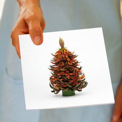 NZ Flax Tree greeting card held in hand, handcrafted by Golly Gosh with vibrant orange, red, and yellow flax flowers