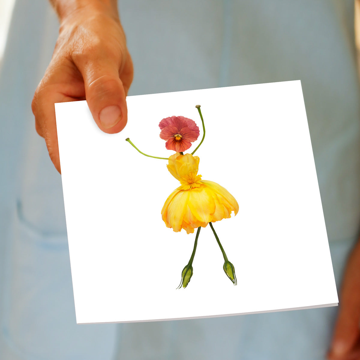 A hand held elegant freesia girl greeting card found at Golly Gosh Creations. Created from vibrant yellow freesia petals. Size 142 x 142 mm.