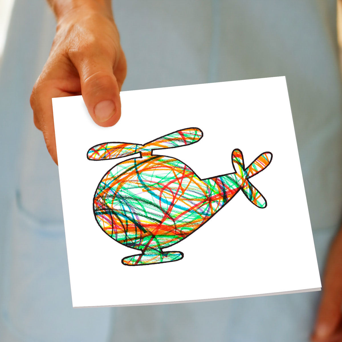 A hand held square greeting card from Golly Gosh Creations. A bright coloured kids drawing of a helicopter on a white background. 
