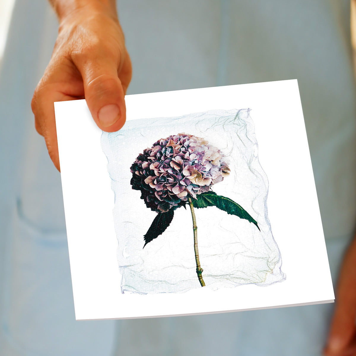 A hand held hydrangea polaroid greeting card from Golly Gosh Creations. Size 142 x 142 mm.
