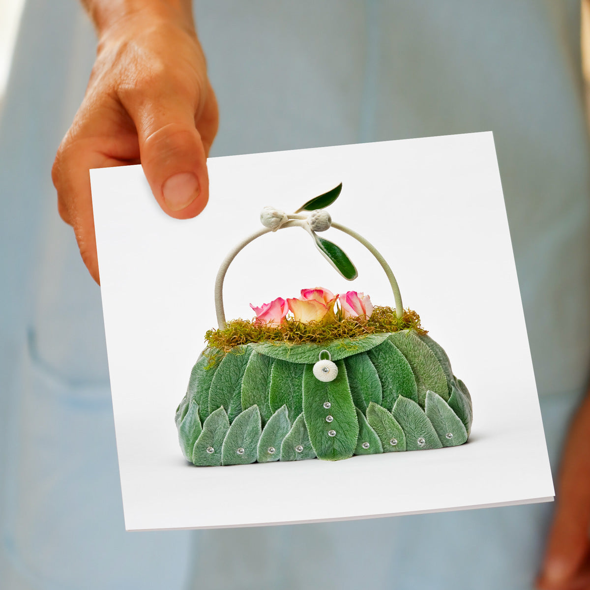 A hand held lambs ear bag greeting card from Golly Gosh Creations. Created from soft velvety lambs ear leaves & flowers. A generous square card.
