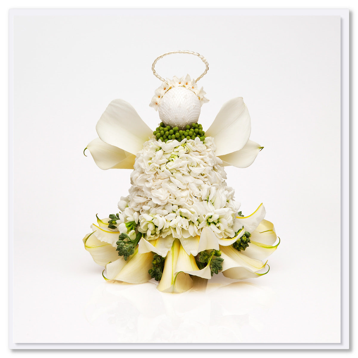 A white lily flower Christmas angel  greeting card from Golly Gosh Creations. Created from fresh flowers on a white background. Size 142 x 142 mm