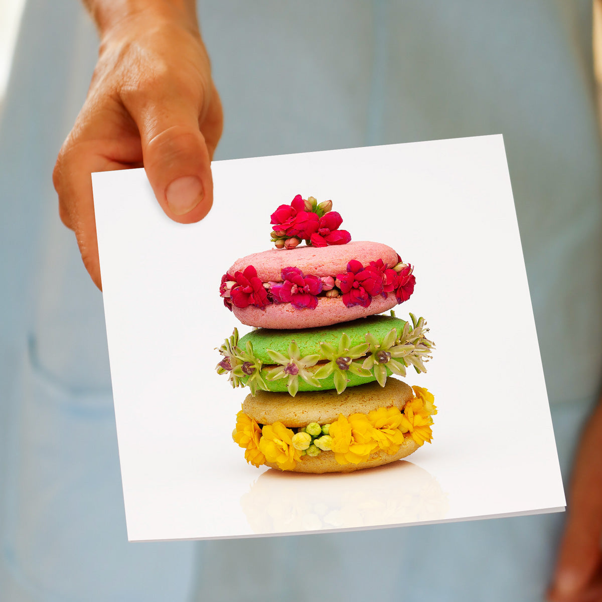 A hand held macaroon stack greeting card from Golly Gosh Creations. A generous square card with a bright stack of handcrafted macaroons.