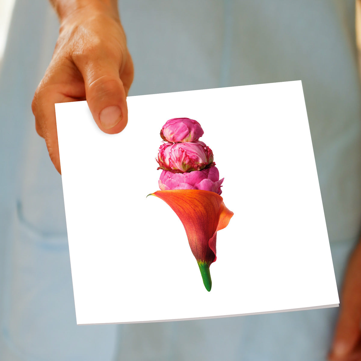 A hand held peony ice cream greeting card from Golly Gosh Creations. This square card is created from lush pink peony heads with an orange lily cone.