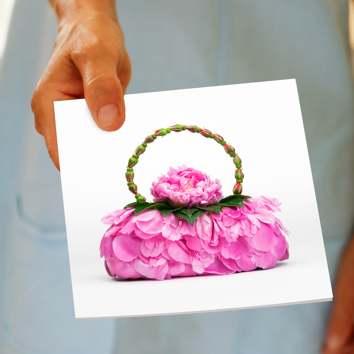 A hand held peony petal bag greeting card from Golly Gosh Creations. Size 142 x 142 mm. This card radiates elegance with it's vibrant pink peony petals.