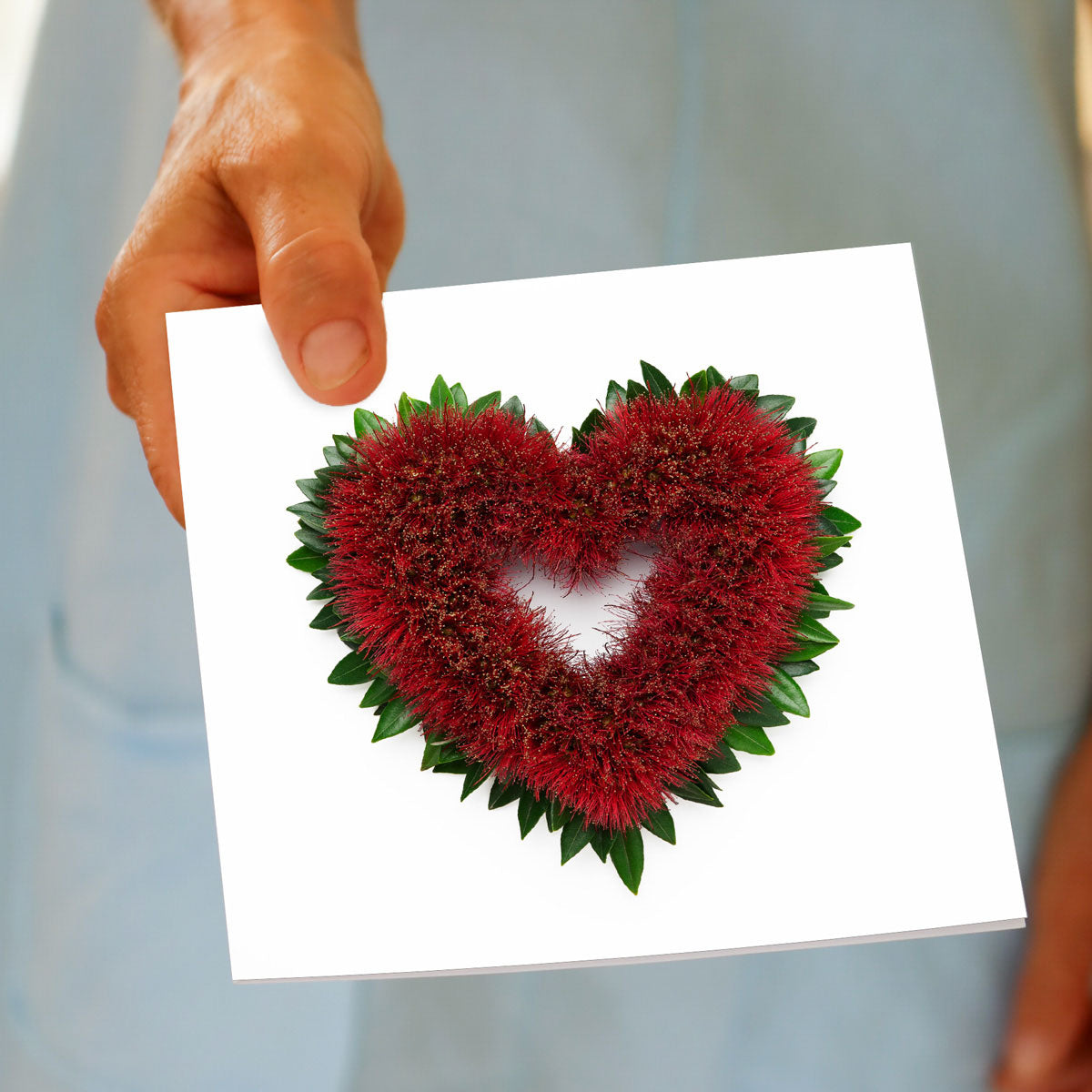 A hand held pohutukawa tree greeting card from Golly Gosh Creations. This generous square card is crafted from the vibrant iconic New Zealand flowering tree.