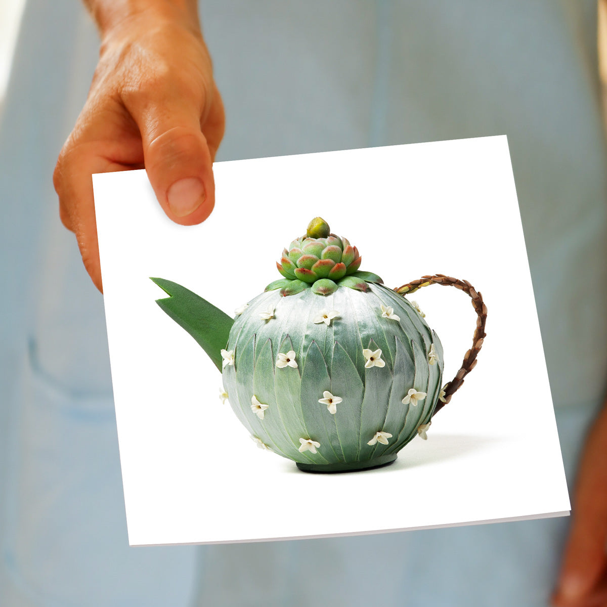 A hand held silver leucadendron teapot greeting card from Golly Gosh Creations. A quality square card created from soft leucadendron leaves.