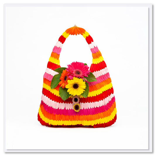 This stripe gerbera petal greeting card is created from colourful gerbera daisy petals. Found at Golly Gosh Creations. Size 142 x 142 mm.