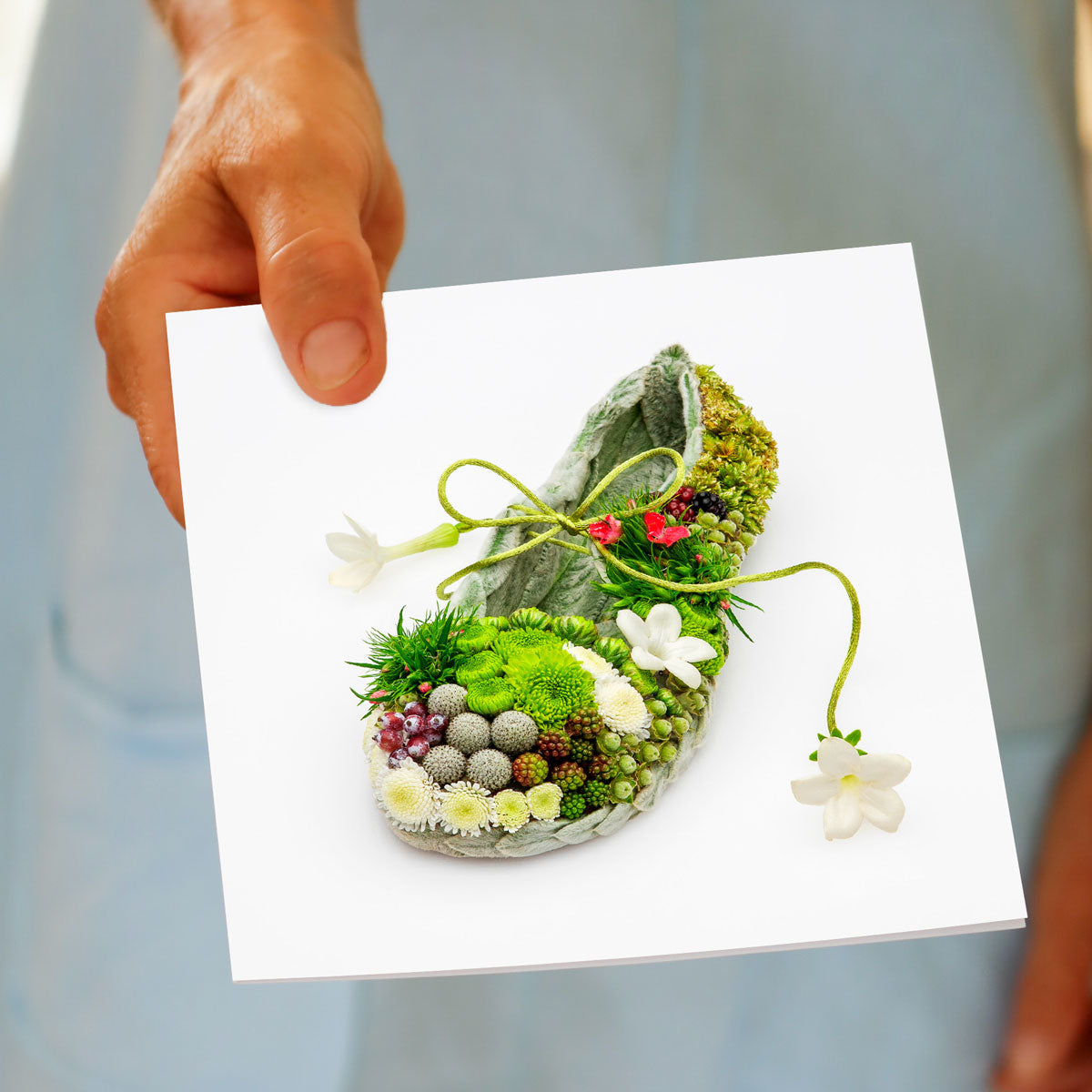 A hand held tapestry shoe greeting card from Golly Gosh Creations. An intricate shoe created from a tapestry of delicate flowers. Size 142 x 142 mm.