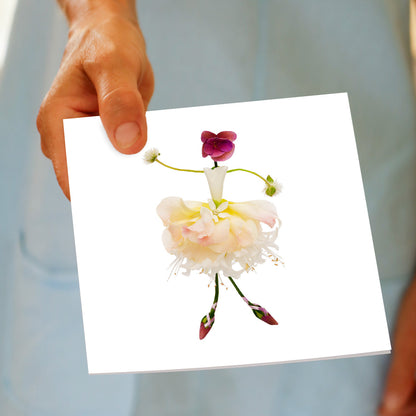 A hand held card of our elegant ballerina made from lilies and hydrangea petals. Standing tall on a white background. Size 142 x 142mm. A quality greeting card found at Golly Gosh Creations.
